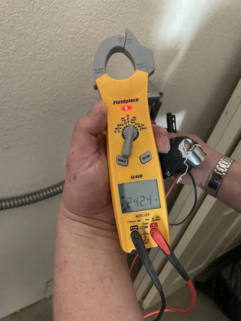 Voltage testing with clamp meter during Ceiling Fan Installation in Shaftsbury